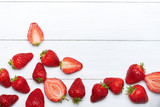 Fototapeta Desenie - strawberry fruits on wooden background