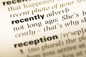 Wall Mural - close up of old english dictionary page with word recently
