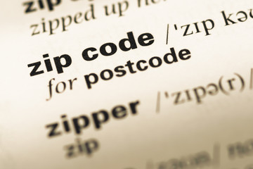 close up of old english dictionary page with word zip code