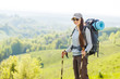 Hiker backpacker girl enjoing journey in mountains