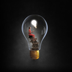 Wall Mural - woman in electric bulb