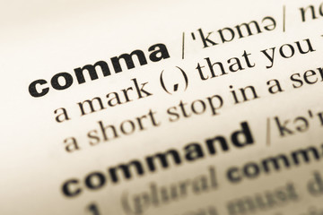 Wall Mural - close up of old english dictionary page with word comma