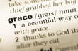 Close up of old English dictionary page with word grace