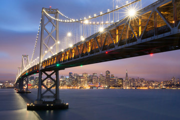 Wall Mural - Dusk over San Francisco-Oakland Bay Bridge and San Francisco Skyline, California, USA.