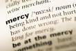 Close up of old English dictionary page with word mercy