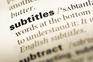 Wall Mural - close up of old english dictionary page with word subtitles