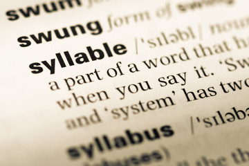 Wall Mural - close up of old english dictionary page with word syllable