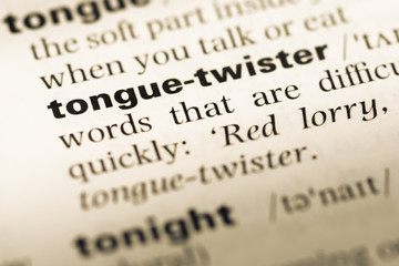 Wall Mural - close up of old english dictionary page with word tongue twister