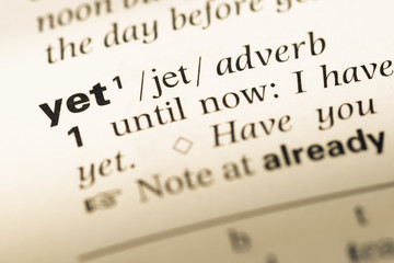 Wall Mural - close up of old english dictionary page with word yet