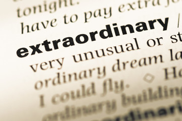 Wall Mural - close up of old english dictionary page with word extraordinary