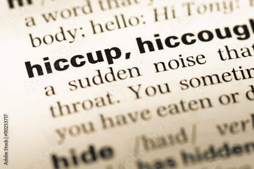 Close up of old English dictionary page with word hiccup Poster