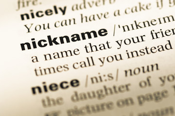 Wall Mural - close up of old english dictionary page with word nickname