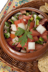 Canvas Print - a bowl of mexican salsa with chips