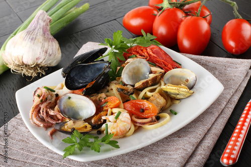 Fotografering Italian pasta with seafood, mussels, clams, shrimp and squid