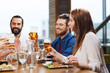 © Syda Productions - friends dining and drinking beer at restaurant