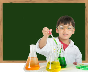 little boy learning in chemecal in science in class