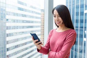 Wall Mural - Woman use of mobile phone