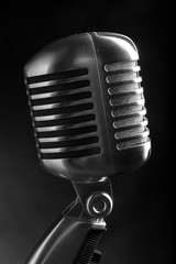 Vintage microphone on black background