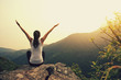 © lzf - young fitness yoga woman at mountain peak