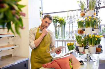 Canvas Print - man with tablet pc computer at flower shop