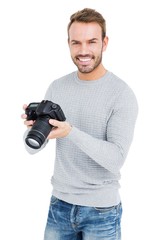 Wall Mural - Young man using camera