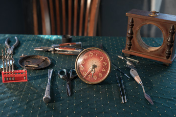 Old clock, repair tools