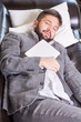 © creativefamily - Sleepy businessman with a tablet device