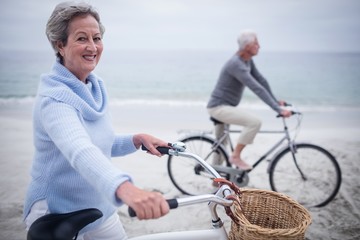 Wall Mural - Senior couple having ride with their bike