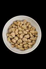 Wall Mural - bowl of brown beans on dark background