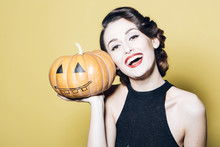 Young Woman With Halloween Pumpkin