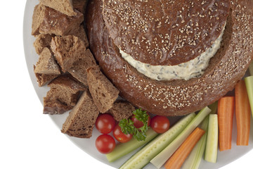 Wall Mural - pumpernickel bread with spinach dip,  vegetables slices and  bread cubes top view