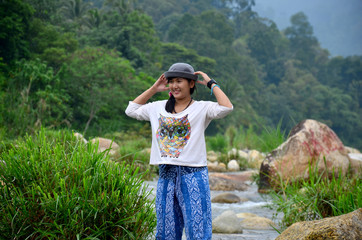 Thai women travel and playing at Taha Waterfalls