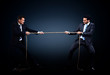 © ASDF - Two business men pulling rope in a competition