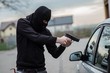 car thief pointing a gun at the driver