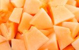 cantaloupe malons slices on white plate on white background