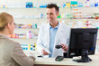 © pikselstock - Pharmacist and client at pharmacy