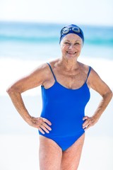 Wall Mural - Pretty mature woman posing on the beach