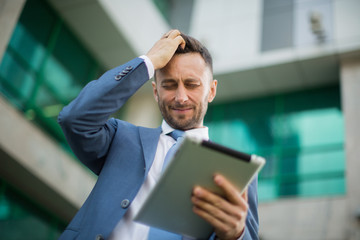 businessman wearing modern suit, blurred background with copy sp