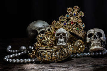 Still life Skull with Treasure Gold jewelry, pirate concept.