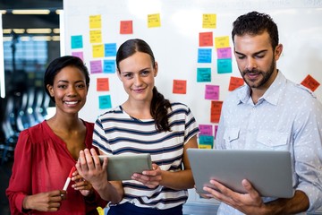 Aufkleber - Colleagues using digital tablet and laptop