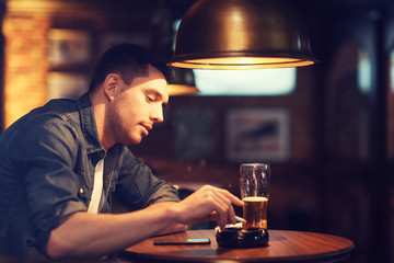 Sticker - man drinking beer and smoking cigarette at bar