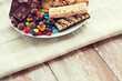 close up of candies, chocolate, muesli and cookies