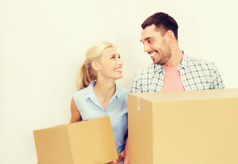 Poster - couple with cardboard boxes moving to new home