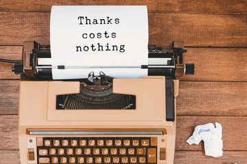 Poster - Composite image of thanks costs nothing message on a white backg