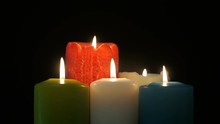 Footage Burning Candles Isolated On A Black Background. 