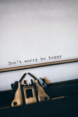 Wall Mural - Don't worry be happy message on a white background 