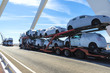Trucks carrying new cars