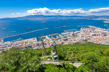 Cable Car Close To The Top Of Gibraltar Rock, Located In The Upper Rock Natural Reserve, And The Spectacular Panoramic Views Of The City. United Kingdom, South West Europe.