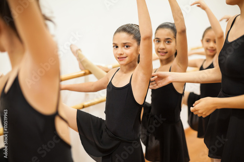 Pretty girl enjoying her ballet class at school Plakát
