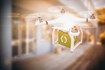 Poster - composite image of digital image of a drone holding a cube